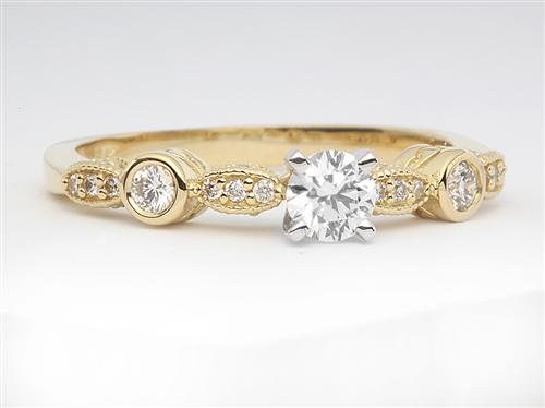 Gold 0.30 Round cut Sidestone Engagement Ring