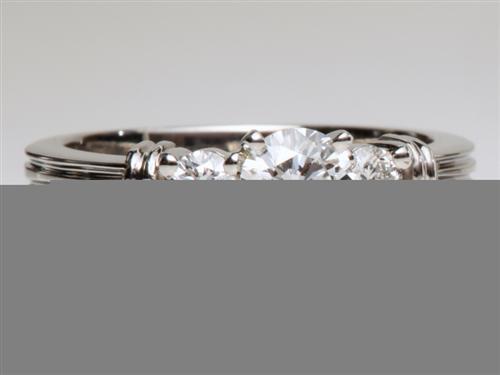 Platinum 0.53 Round cut Side Stone Engagement Ring